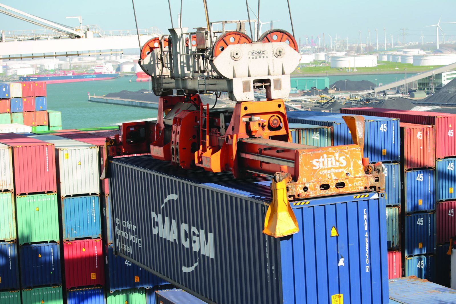 A ship's crane against an overcast sky at a working berth.