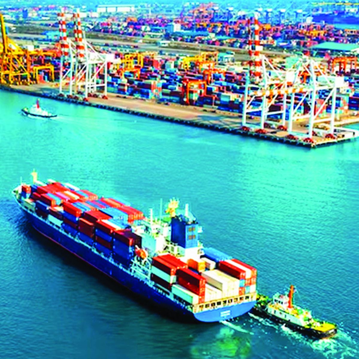 A superintendent's view across a working port at first light.
