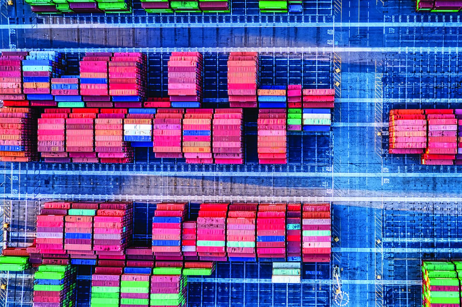 Aerial view of a container terminal with stacked boxes.