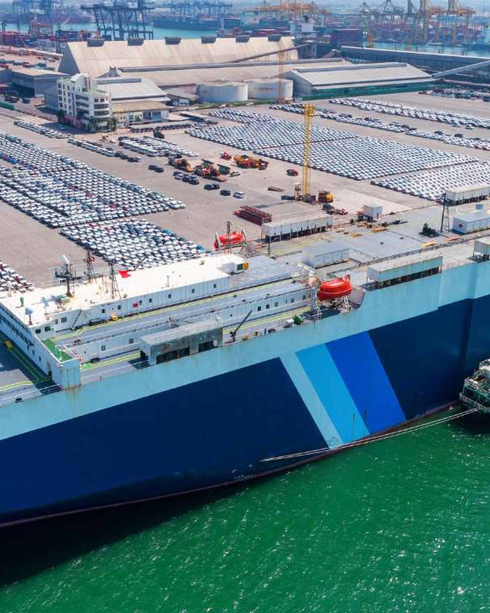 A ro-ro vessel with her stern ramp down at a freight terminal.